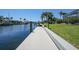 Concrete dock with direct access to the canal and waterfront views of boats at 48 Hibiscus Dr, Punta Gorda, FL 33950