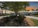 Charming home featuring a well-manicured lawn, rock garden and circular driveway at 48 Hibiscus Dr, Punta Gorda, FL 33950