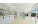 Enclosed sunroom featuring neutral flooring, ceiling fan, and a view of the pool provides a relaxing space at 48 Hibiscus Dr, Punta Gorda, FL 33950