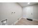 Clean and modern laundry room area offers functionality and convenience, featuring a door, connections, and neutral finishes at 48 Hibiscus Dr, Punta Gorda, FL 33950
