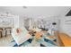 Spacious living room with modern decor, open to dining area and kitchen at 48 Hibiscus Dr, Punta Gorda, FL 33950