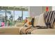 A comfy white couch with vibrant pillows overlooks the pool at 48 Hibiscus Dr, Punta Gorda, FL 33950