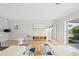 Contemporary living room with a unique rug, modern furniture, and bright, neutral walls at 48 Hibiscus Dr, Punta Gorda, FL 33950