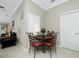 Breakfast nook featuring access to the living room and views of the backyard at 4992 Brittain Way, North Port, FL 34287