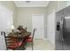 Breakfast nook featuring stainless steel refrigerator and views of the backyard at 4992 Brittain Way, North Port, FL 34287