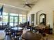 Comfortable clubhouse interior with ample seating, tables, and views of the pool at 4992 Brittain Way, North Port, FL 34287