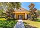 Inviting community clubhouse featuring a manicured lawn and a sidewalk leading to the entrance at 4992 Brittain Way, North Port, FL 34287