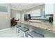 Kitchen with granite countertops, stainless steel appliances, and a breakfast bar with seating at 4992 Brittain Way, North Port, FL 34287