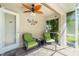 Enclosed patio featuring green seating, a ceiling fan, and plenty of natural light at 4992 Brittain Way, North Port, FL 34287