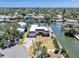 Gorgeous waterfront home with lush landscaping, a private backyard, and access to the canal, perfect for boating at 5181 Sandy Shore Ave, Sarasota, FL 34242