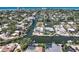 Amazing canal-front homes showcasing waterfront living, lush landscaping, and convenient boat access to the bay at 5181 Sandy Shore Ave, Sarasota, FL 34242