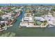 Stunning waterfront property with a private pool, dock, and beautifully landscaped backyard, perfect for entertaining at 5181 Sandy Shore Ave, Sarasota, FL 34242