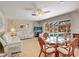 Living room with waterfront views, features comfortable seating and access to the pool area at 5181 Sandy Shore Ave, Sarasota, FL 34242