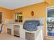 Outdoor kitchen with sink, grill, and storage, perfect for outdoor cooking and entertaining at 5181 Sandy Shore Ave, Sarasota, FL 34242