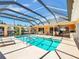 Screened-in pool with ample deck space and outdoor seating areas, ideal for relaxing at 5181 Sandy Shore Ave, Sarasota, FL 34242