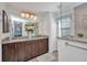 Ensuite bathroom features a double vanity, granite countertop, and walk-in shower at 526 Allen St, Punta Gorda, FL 33950