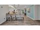 Beautiful kitchen featuring white cabinetry, pendant lighting, granite countertops, and stainless steel appliances at 526 Allen St, Punta Gorda, FL 33950