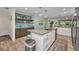 Bright, modern kitchen with an island, granite counters and pendant lighting at 526 Allen St, Punta Gorda, FL 33950
