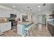 Bright eat-in kitchen featuring stainless appliances, granite countertops and a large island at 526 Allen St, Punta Gorda, FL 33950