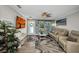 Cozy living room with natural light, coastal-themed decor, and neutral-toned furniture for relaxed living at 526 Allen St, Punta Gorda, FL 33950