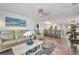 Bright, open living room seamlessly connects to a modern kitchen and bar area with a coastal, stylish decor at 526 Allen St, Punta Gorda, FL 33950