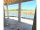 An expansive window view of a picturesque landscape with a pond at 7 Sunflower Dr, Placida, FL 33946