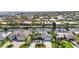 Beautiful waterfront home featuring lush landscaping, a private dock, and scenic canal views, ideal for boating enthusiasts at 80 Hibiscus Dr, Punta Gorda, FL 33950