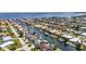 Expansive aerial view of a waterfront community with canals, docks, and homes at 80 Hibiscus Dr, Punta Gorda, FL 33950