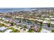 Expansive aerial shot of a residential community with canals, waterfront homes, and palm tree landscaping at 80 Hibiscus Dr, Punta Gorda, FL 33950