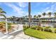 A landscaped backyard has a walkway to a boat dock and canal at 80 Hibiscus Dr, Punta Gorda, FL 33950