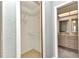 Bright closet with coated wire shelving; bathroom with double sinks is just through the doorway at 80 Hibiscus Dr, Punta Gorda, FL 33950