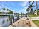 Waterfront property featuring a private dock with boat lift and canal access at 80 Hibiscus Dr, Punta Gorda, FL 33950