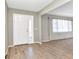 Bright entryway with tiled floors, a white front door with glass, and a view into the adjacent living area at 80 Hibiscus Dr, Punta Gorda, FL 33950