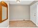 Light-filled entryway with tiled floors, a decorative mirror, and a view of the front door at 80 Hibiscus Dr, Punta Gorda, FL 33950