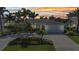 Elegant single-Gathering home with lush landscaping, a spacious driveway, and an attached garage, perfect for comfortable living at 80 Hibiscus Dr, Punta Gorda, FL 33950