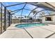 A screened-in pool features stunning views of the canal at 80 Hibiscus Dr, Punta Gorda, FL 33950