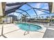 A screened-in pool features stunning views of the canal at 80 Hibiscus Dr, Punta Gorda, FL 33950
