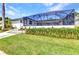 Screened patio with spacious backyard and lush landscaping, ideal for outdoor living and entertaining at 80 Hibiscus Dr, Punta Gorda, FL 33950