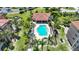 Stunning aerial shot of the community pool, surrounded by lush landscaping and well-maintained grounds at 95 N Marion Ct # 135, Punta Gorda, FL 33950