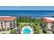 Beautiful community pool and spa area with ocean views, surrounded by lush landscaping at 95 N Marion Ct # 135, Punta Gorda, FL 33950
