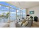 Serene balcony with ample windows and comfortable seating with a view of the ocean at 95 N Marion Ct # 135, Punta Gorda, FL 33950