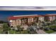 Luxury condos with waterfront views, palm trees, and well-manicured landscaping at 95 N Marion Ct # 135, Punta Gorda, FL 33950