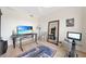 This is a home office featuring a zebra rug, desk, and a full length mirror at 95 N Marion Ct # 135, Punta Gorda, FL 33950