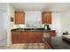 Well-equipped kitchen features wood cabinetry, stainless steel appliances, and a functional layout at 95 N Marion Ct # 135, Punta Gorda, FL 33950