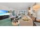 Spacious living room offers natural light, comfortable seating, and access to outdoor views at 95 N Marion Ct # 135, Punta Gorda, FL 33950