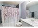 A full bathroom includes a tub and shower combo, a toilet, and a vanity at 105 Biscayne Dr, Port Charlotte, FL 33953