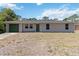Charming single story home featuring an attached garage and well-maintained lawn at 105 Biscayne Dr, Port Charlotte, FL 33953