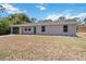 Charming single story home featuring an attached garage and well-maintained lawn at 105 Biscayne Dr, Port Charlotte, FL 33953