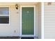 The front door is green and has a white frame, with the house number in the upper left at 105 Biscayne Dr, Port Charlotte, FL 33953