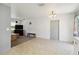 Open living space with neutral walls, tile flooring, and view of the backyard at 105 Biscayne Dr, Port Charlotte, FL 33953